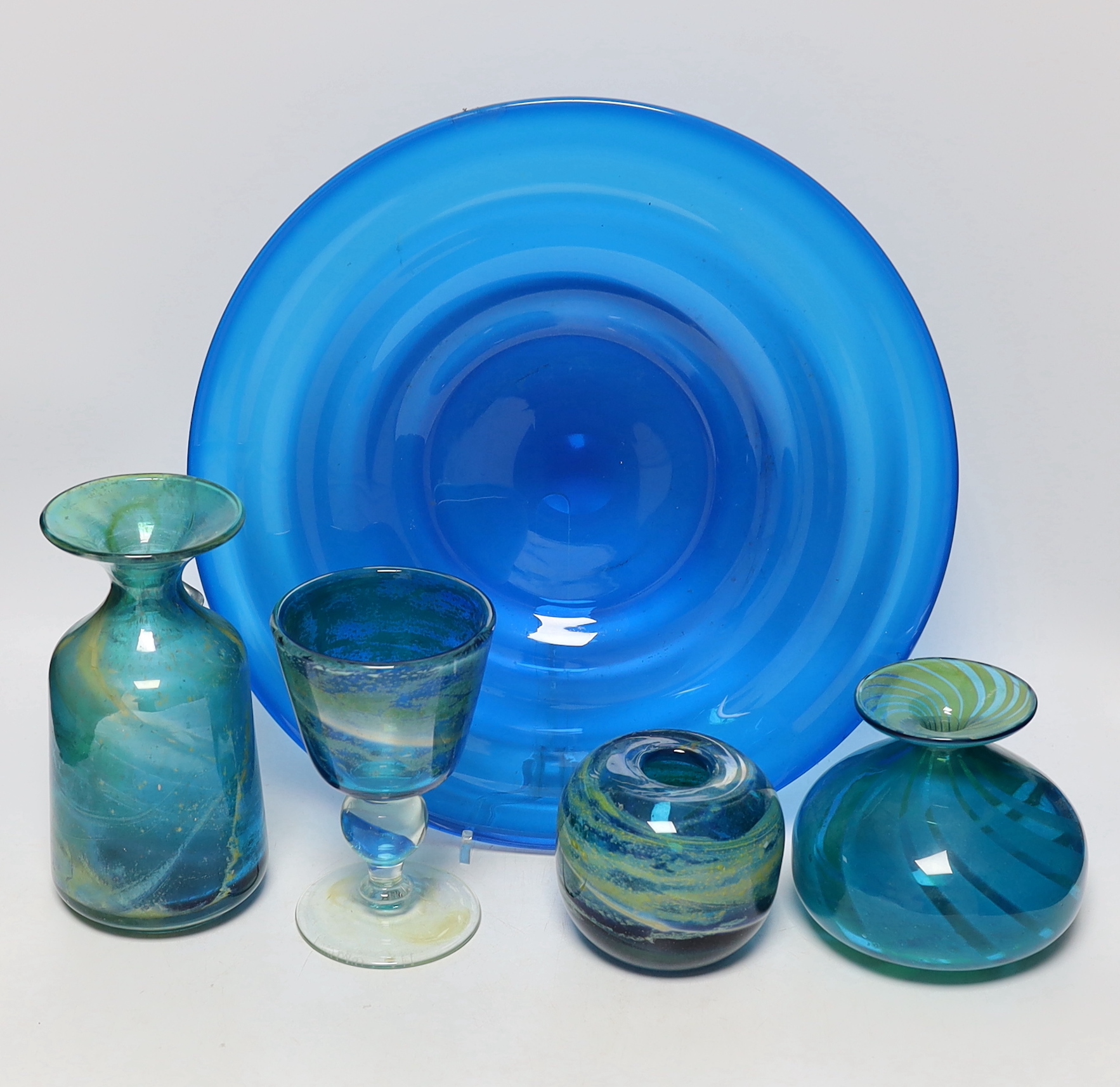 Four pieces of Mdina glass, three signed together with a blue glass dish, largest Mdina vase 19.5cm high